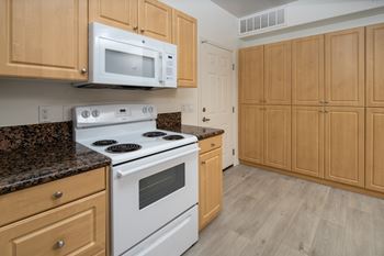 Minimal kitchen with brown wood cabinets